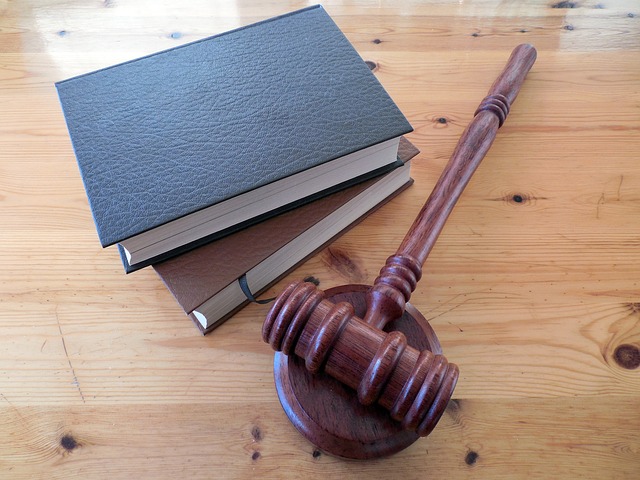 divorce at 50 - judges gavel and books on wooden table