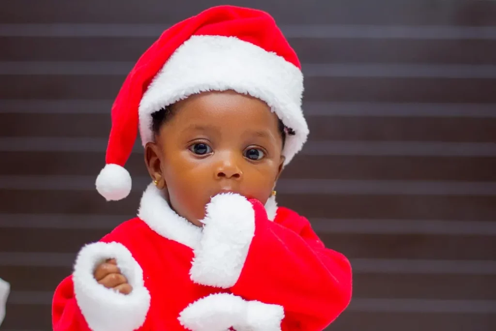 Picture of a child in a Santa suit for the article about joint custody holiday schedules during a divorce.