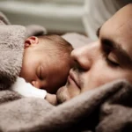 Picture of a man and a baby for the article about affidavit of parentage