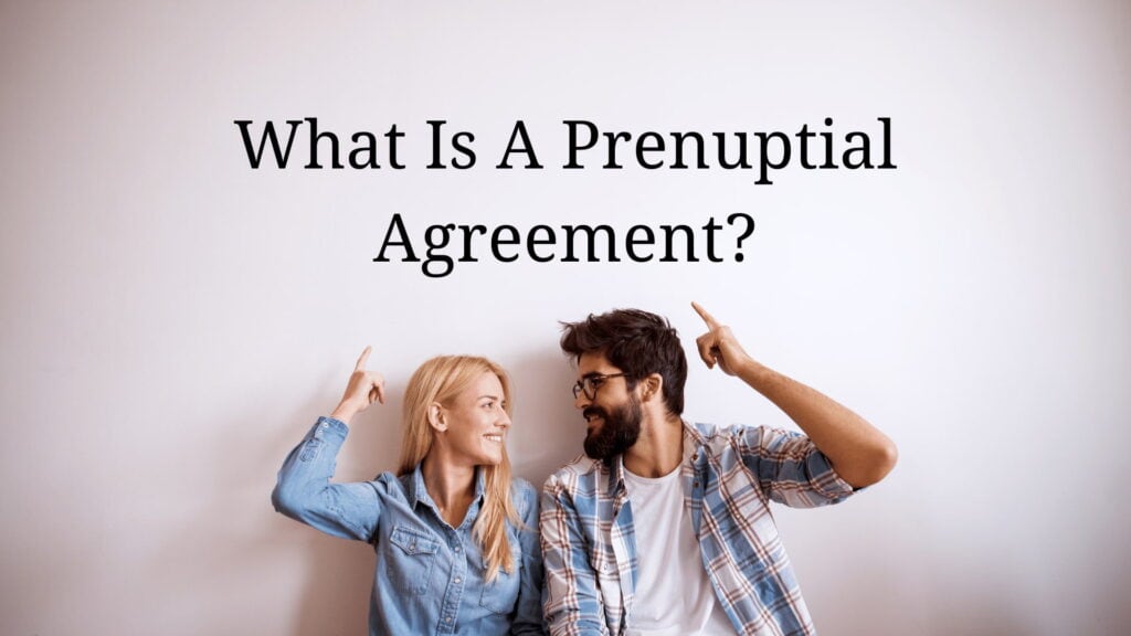 Couple smiling pointing up at the words what is a prenuptial agreement?